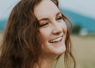 Young woman laughing happily