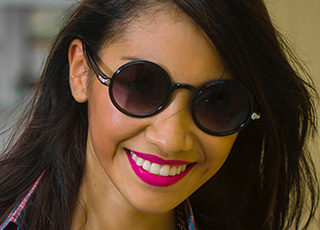 Woman with beautiful smile and sunglasses