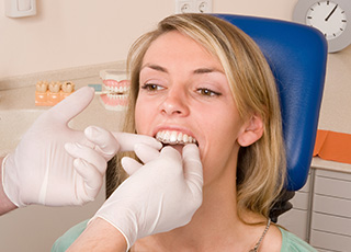Dentist placing aligner